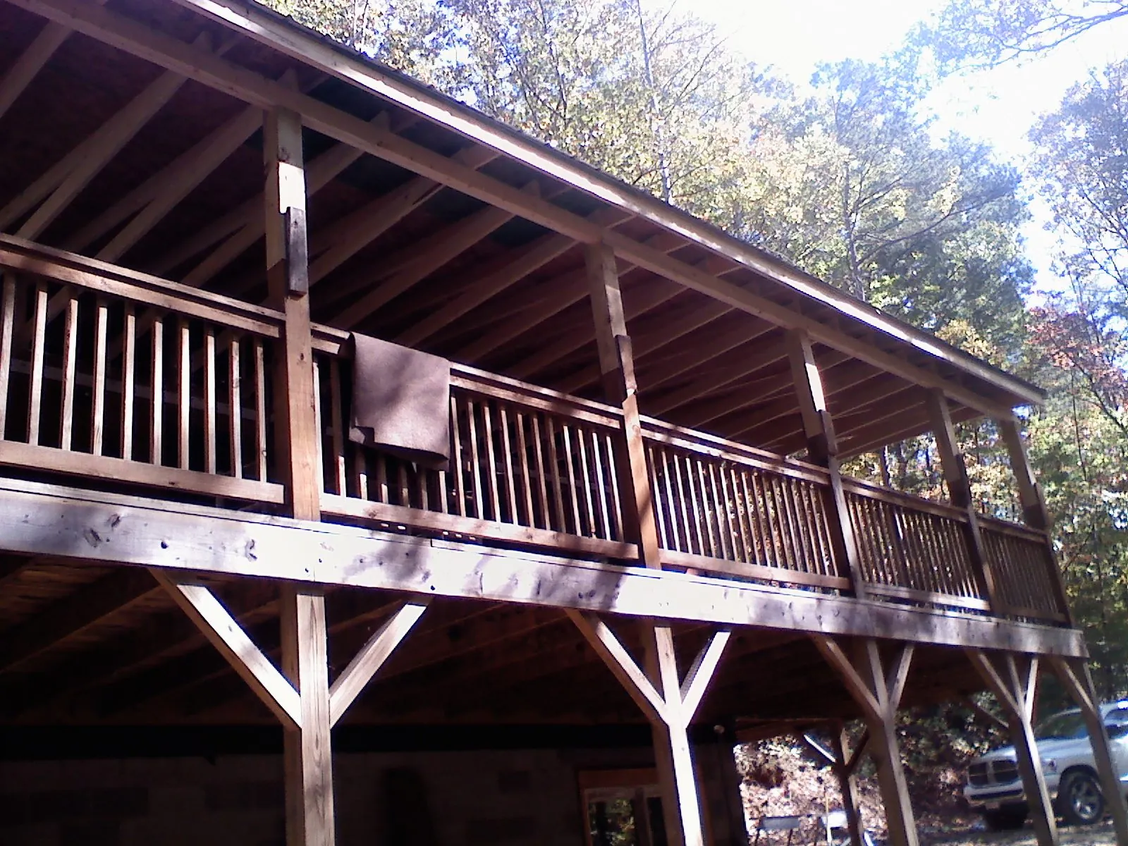 Timber framing under a new elevated porch and deck — Roof Leak Repair in Amherst by Roofing Brothers